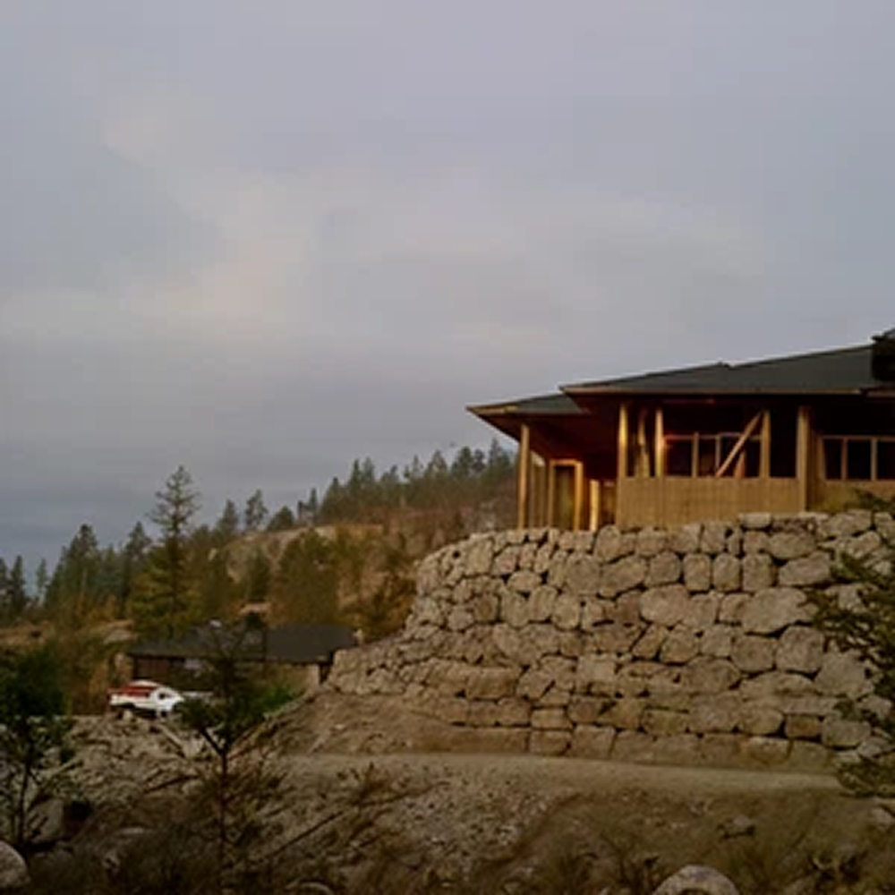 Contemporary home with stone wall